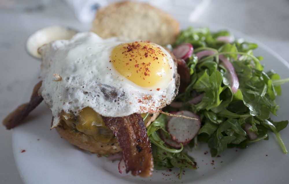 Burger with bacon and egg - pic by Robin B. on Yelp - Hank's in Austin near Alexan Springdale